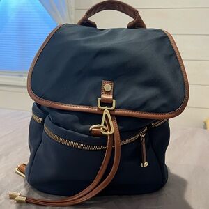 Calvin Klein Navy Nylon Backpack with Brown and gold embellishments.